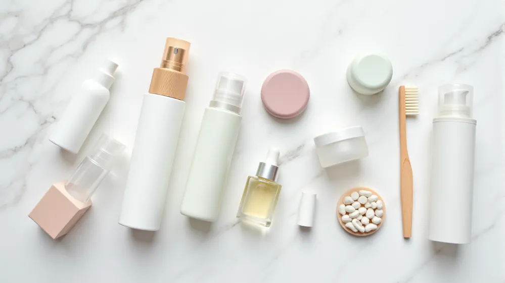 Collection of travel-sized containers and solid toiletry alternatives for efficient packing.
